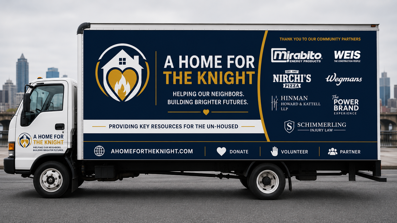 Driver side of the A Home For The Knight relief truck showing community partner logos